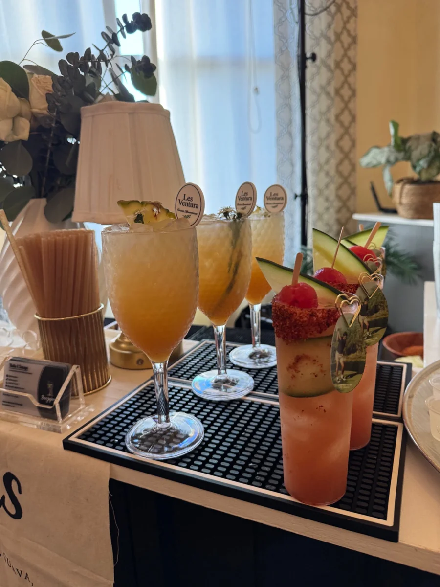 Cocktails arranged on a wooden bar tray